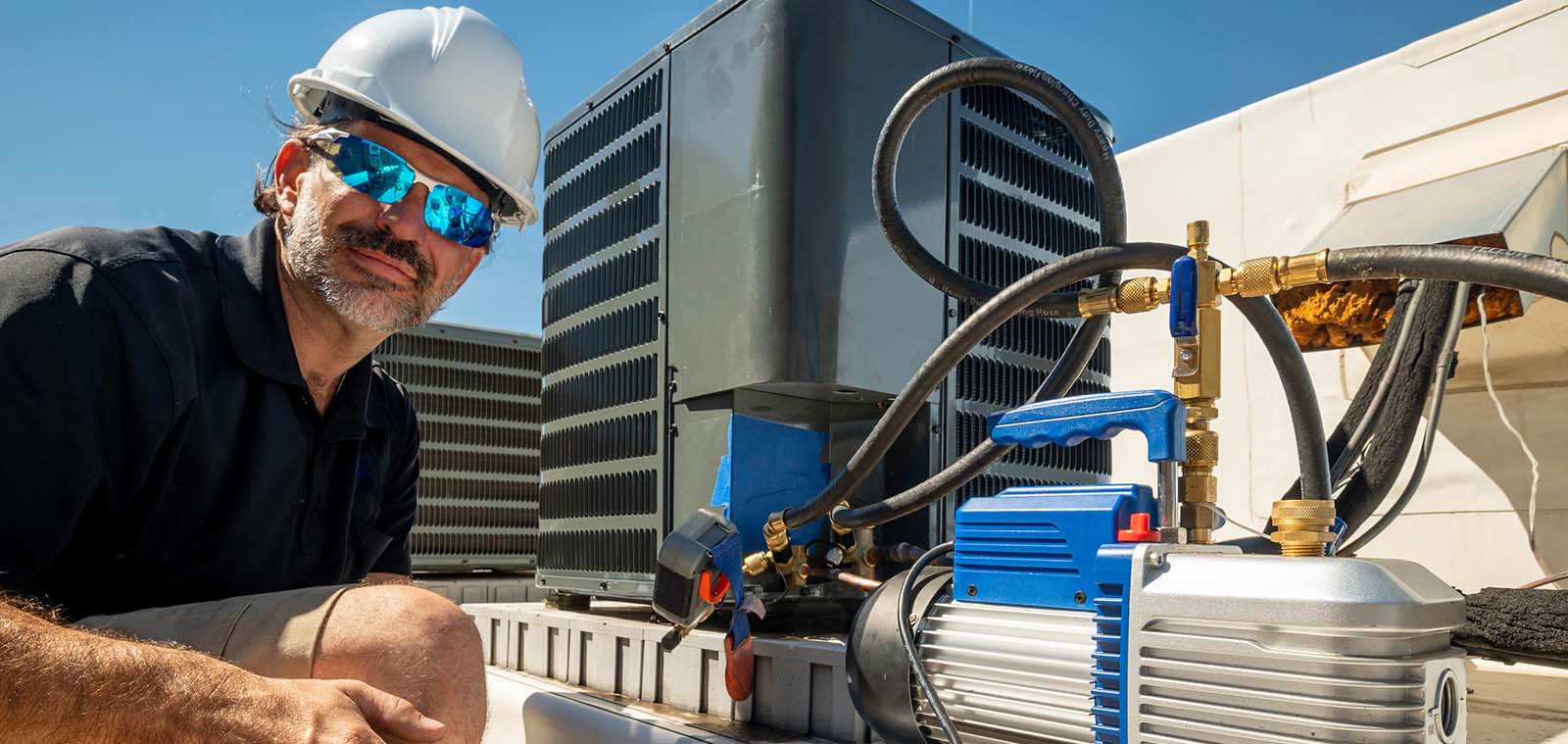 hvac-technician-working-on-hvac-unit