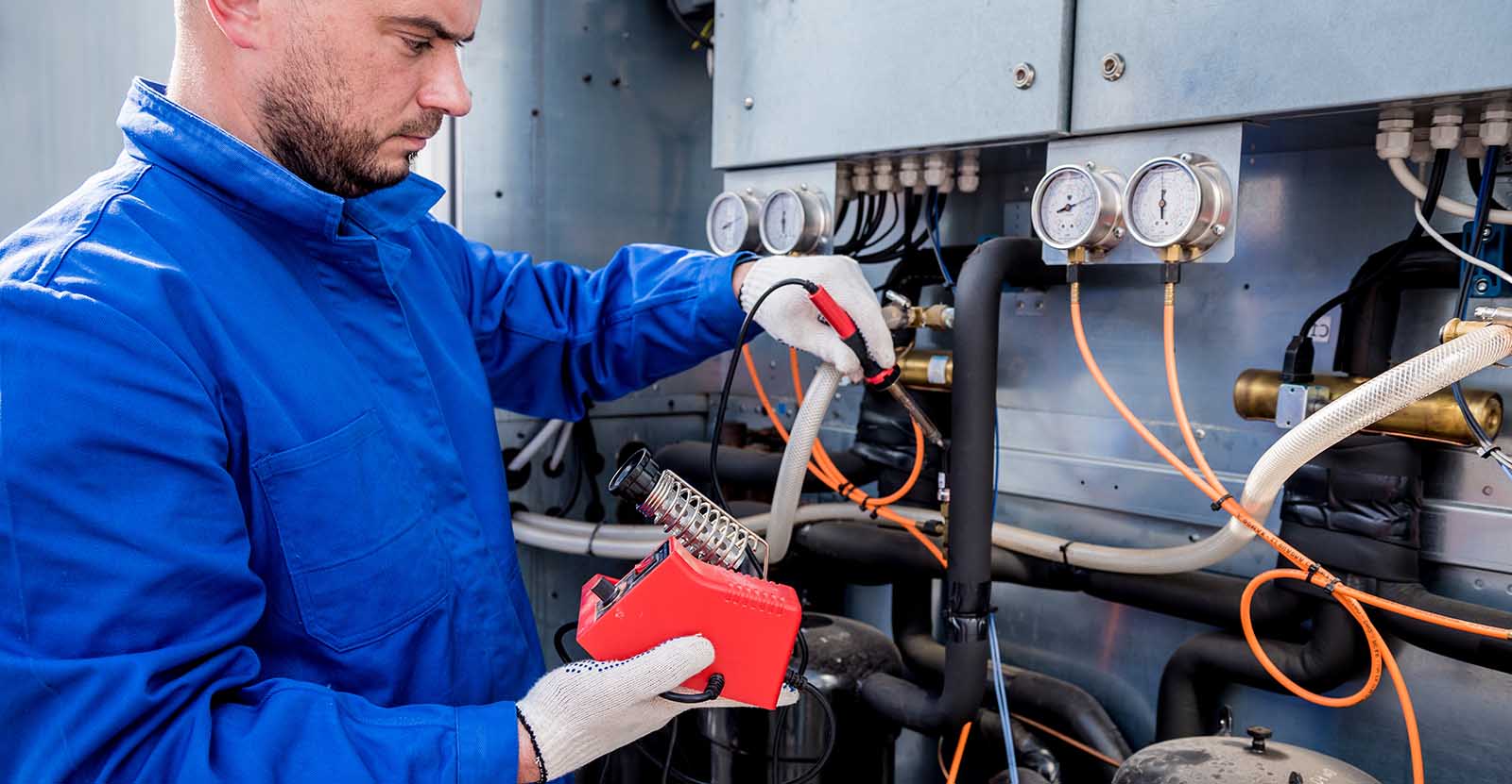 hvac-technician-testing-hvac-equipment
