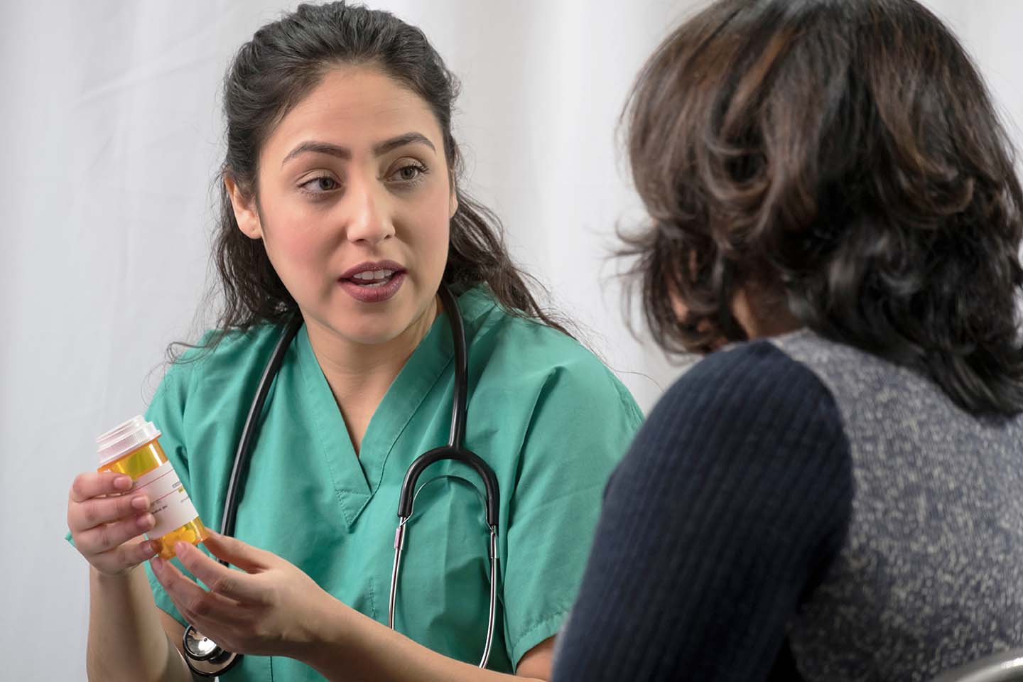 medical-assistant-with-medication-bottle